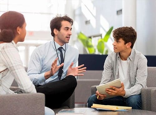 Teacher Talking to Student